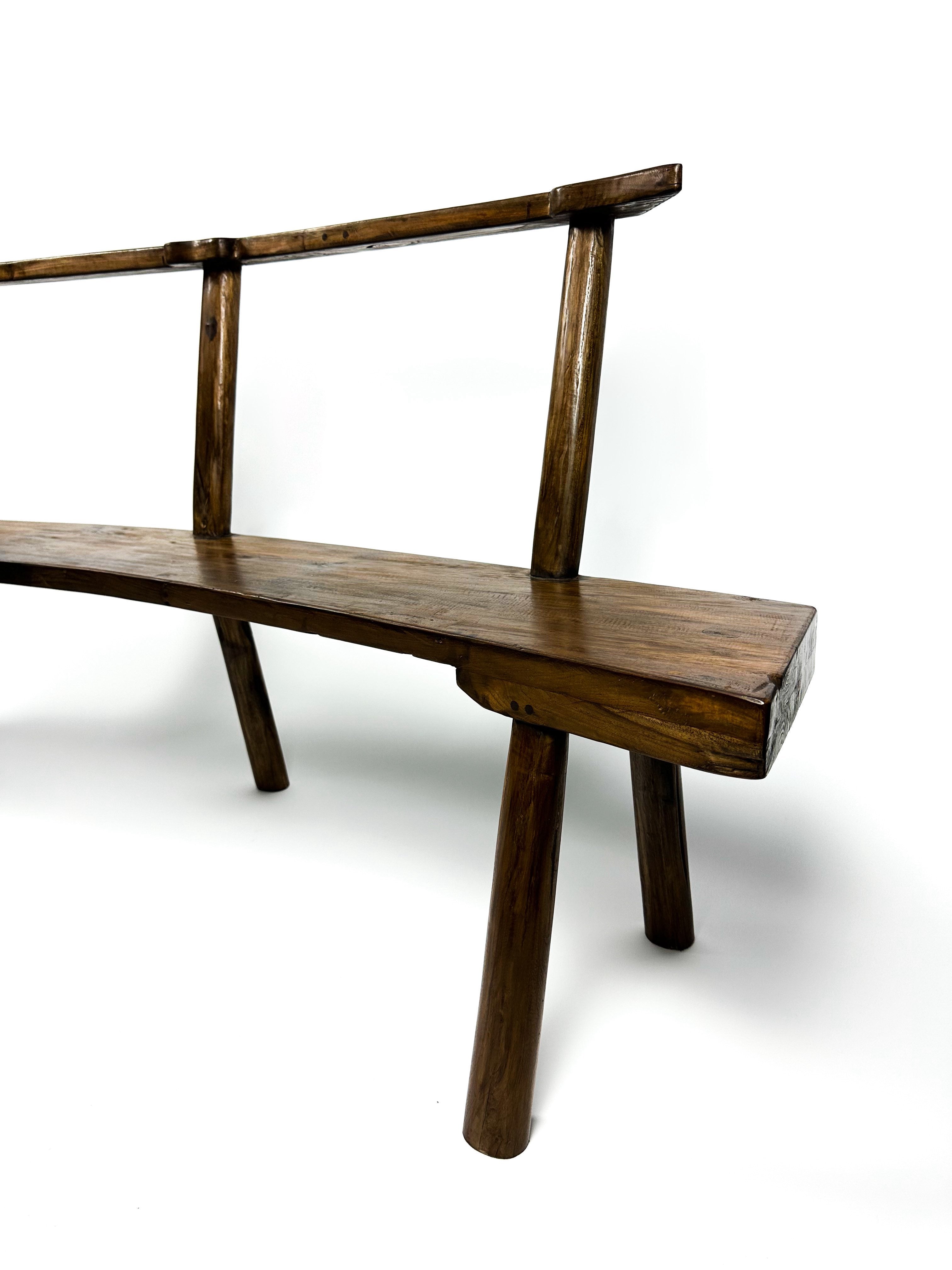 The curved teak bench