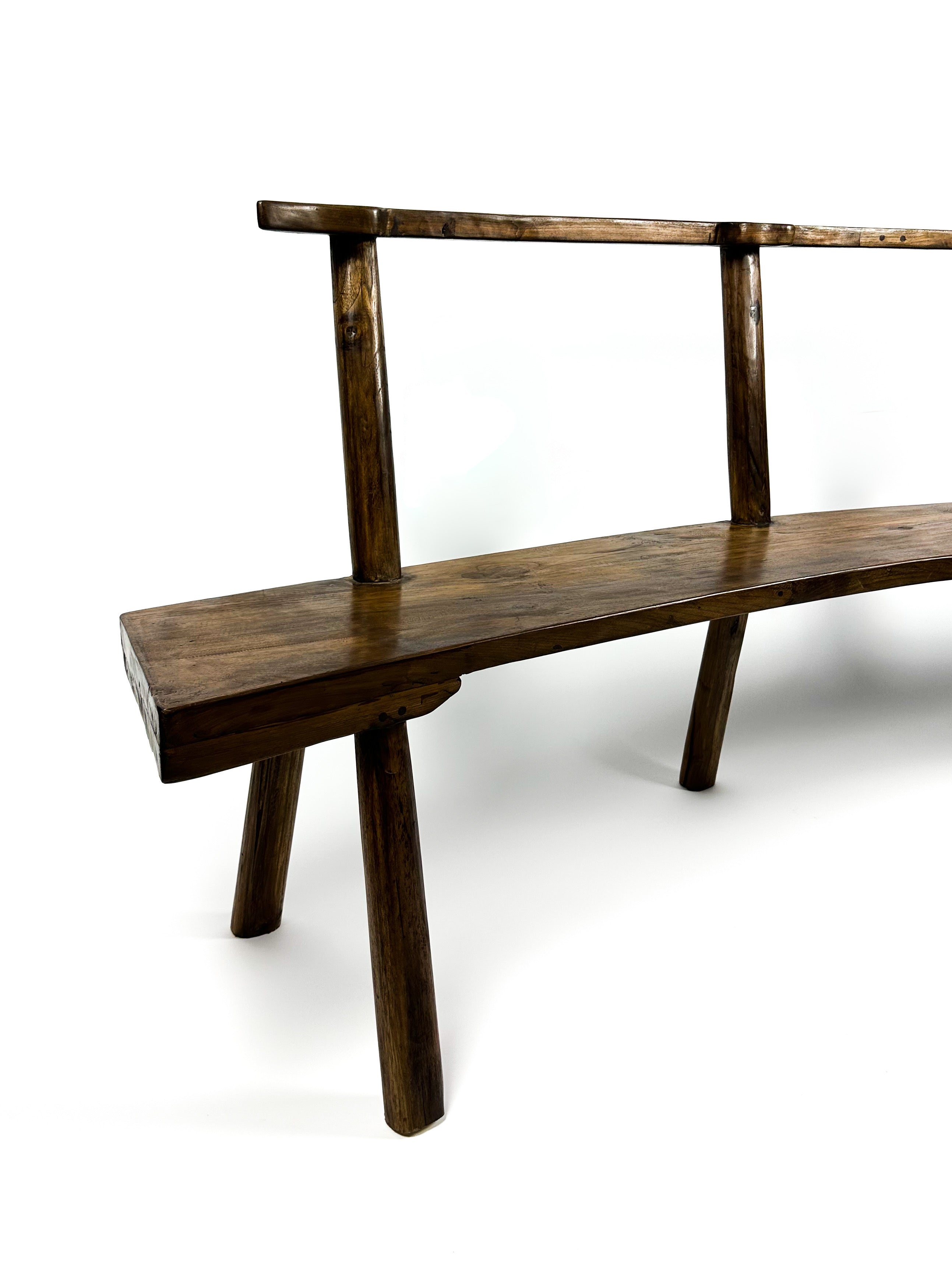 The curved teak bench