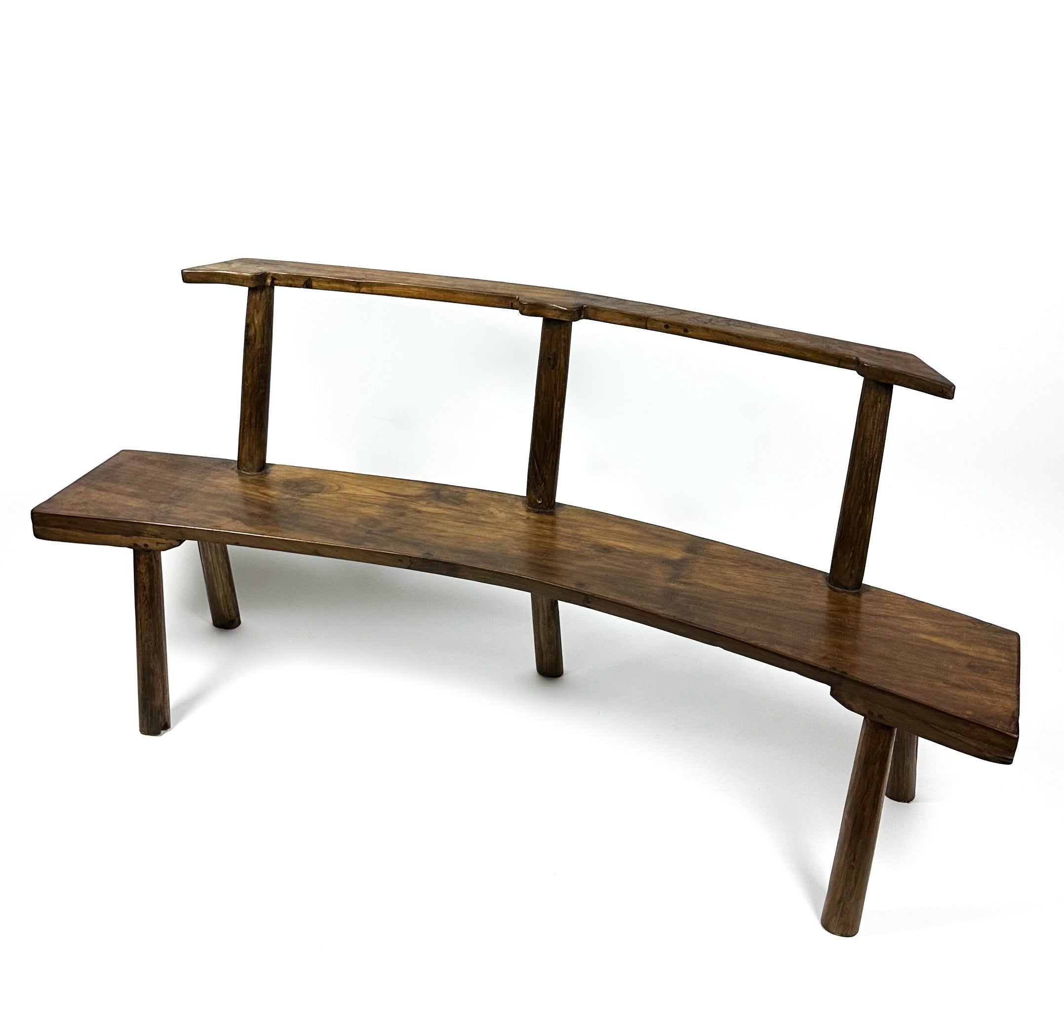 The curved teak bench
