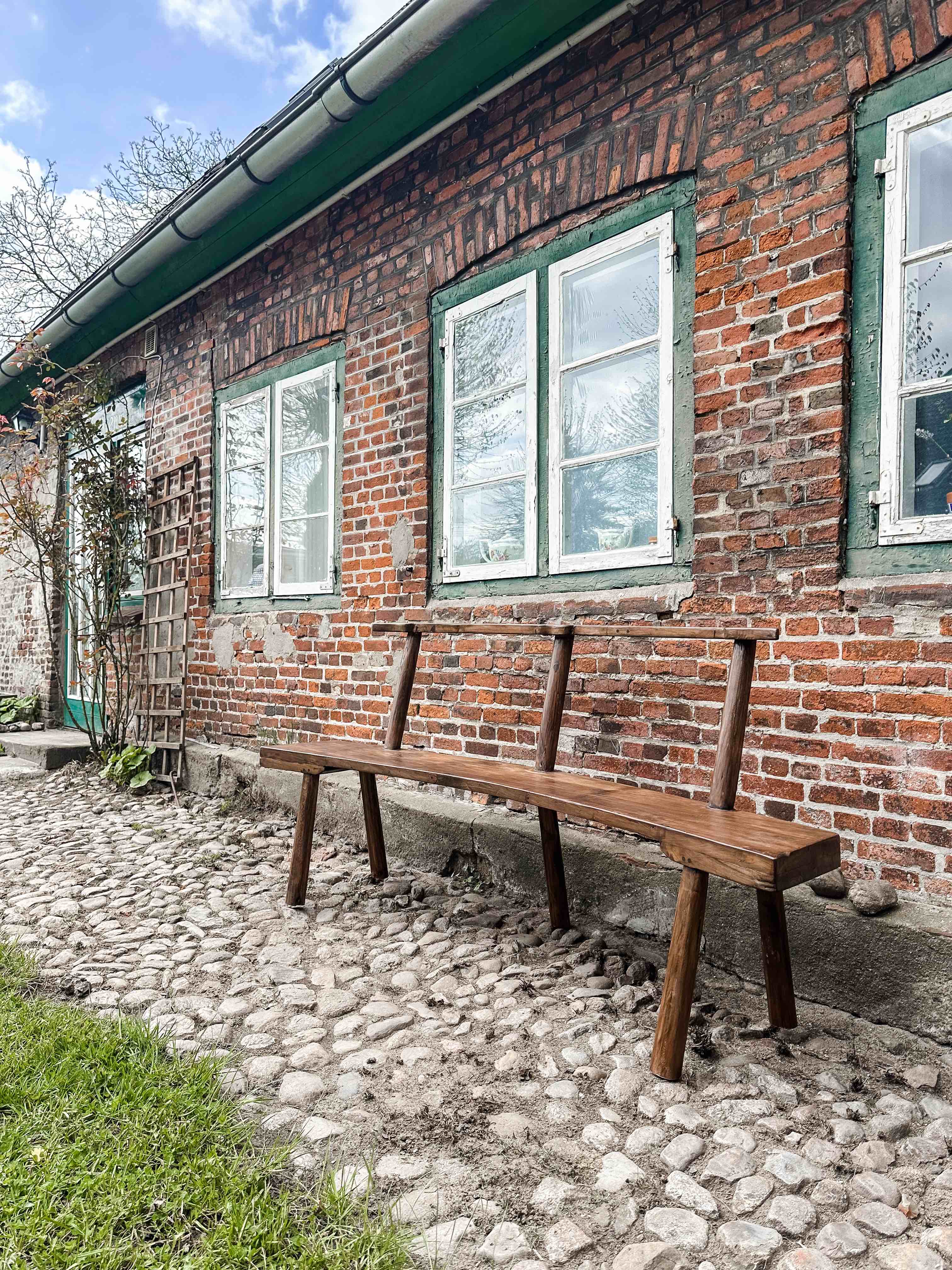 The curved teak bench