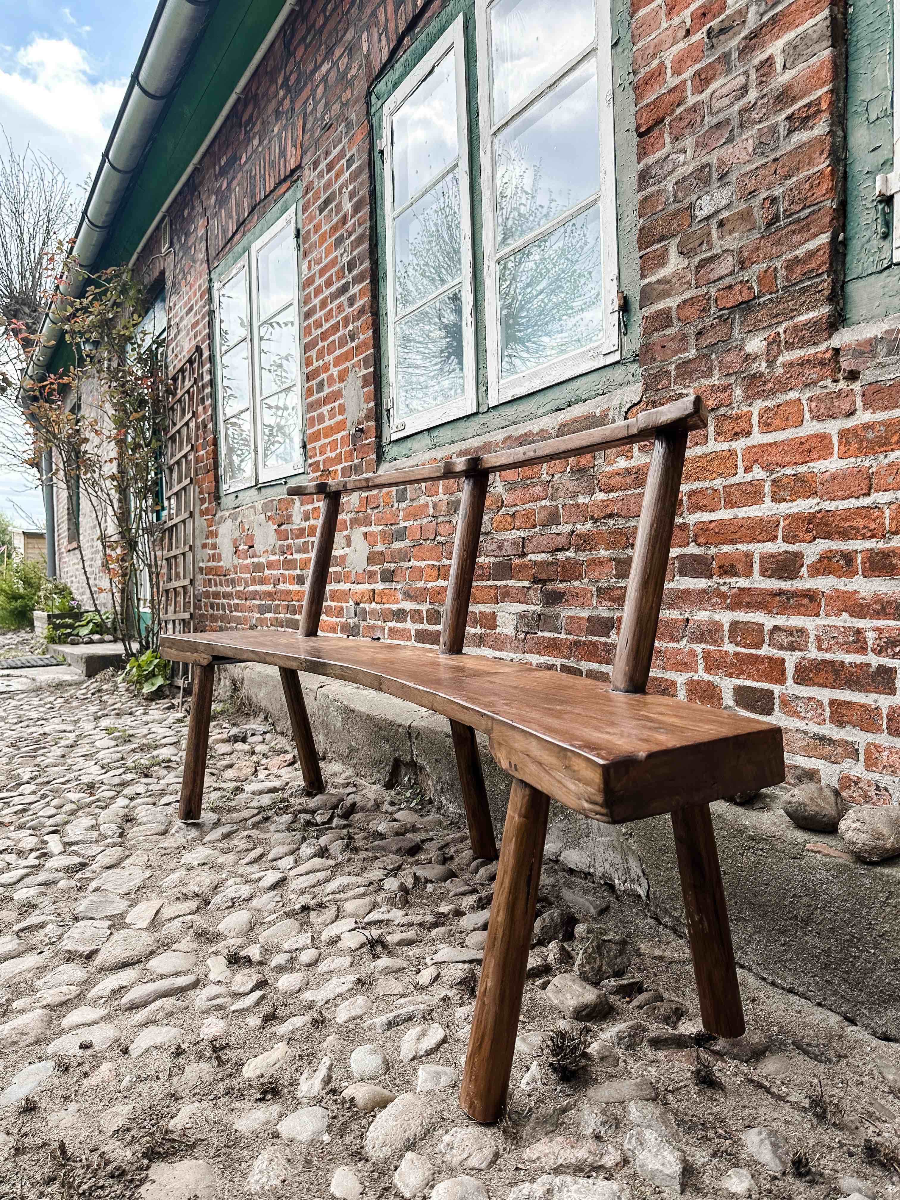 The curved teak bench