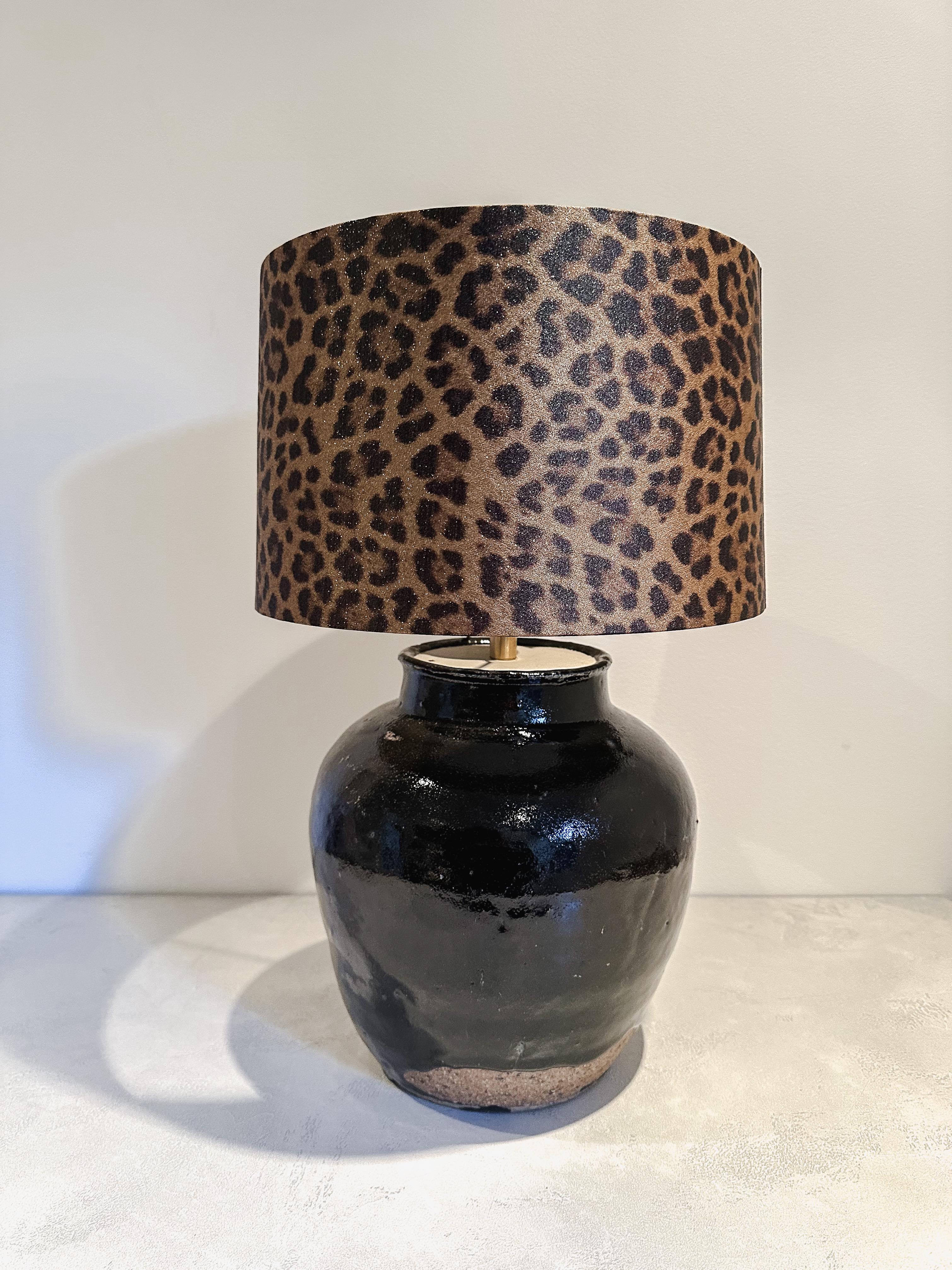 antique urn lamp with Leo print shade