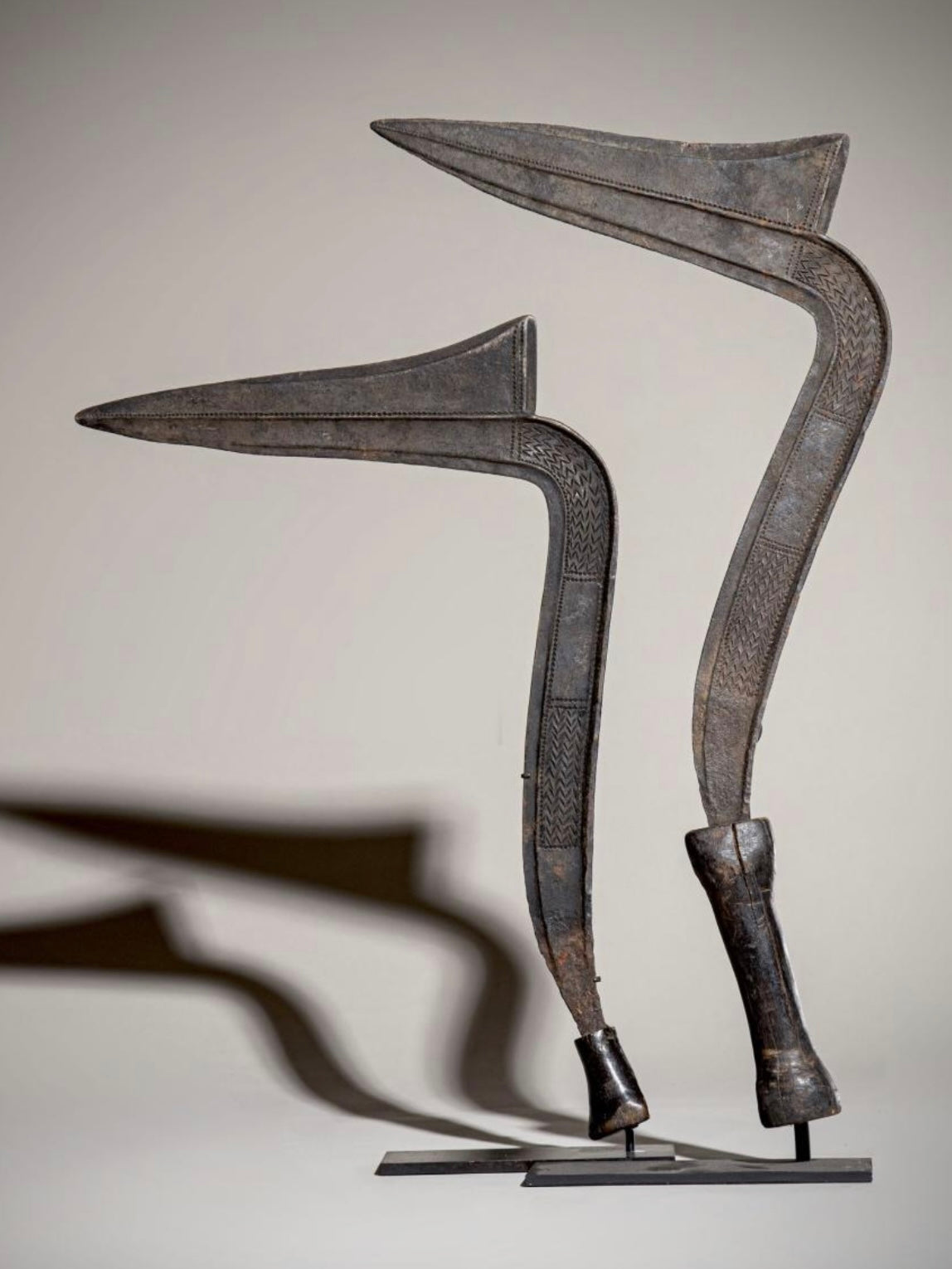 A pair of old metal Iboko scepters with wooden handles from the Democratic Republic of the Congo