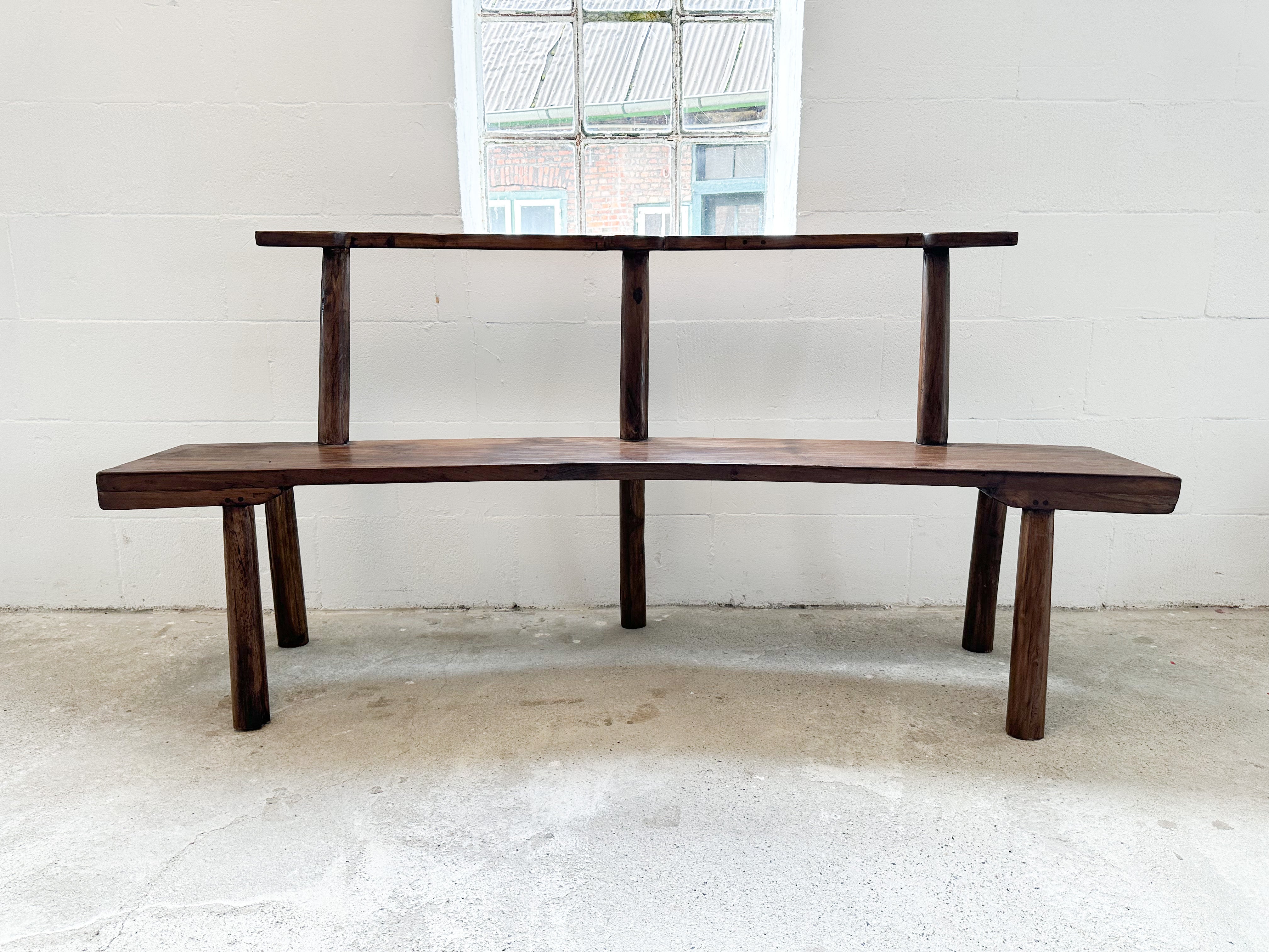 The curved teak bench