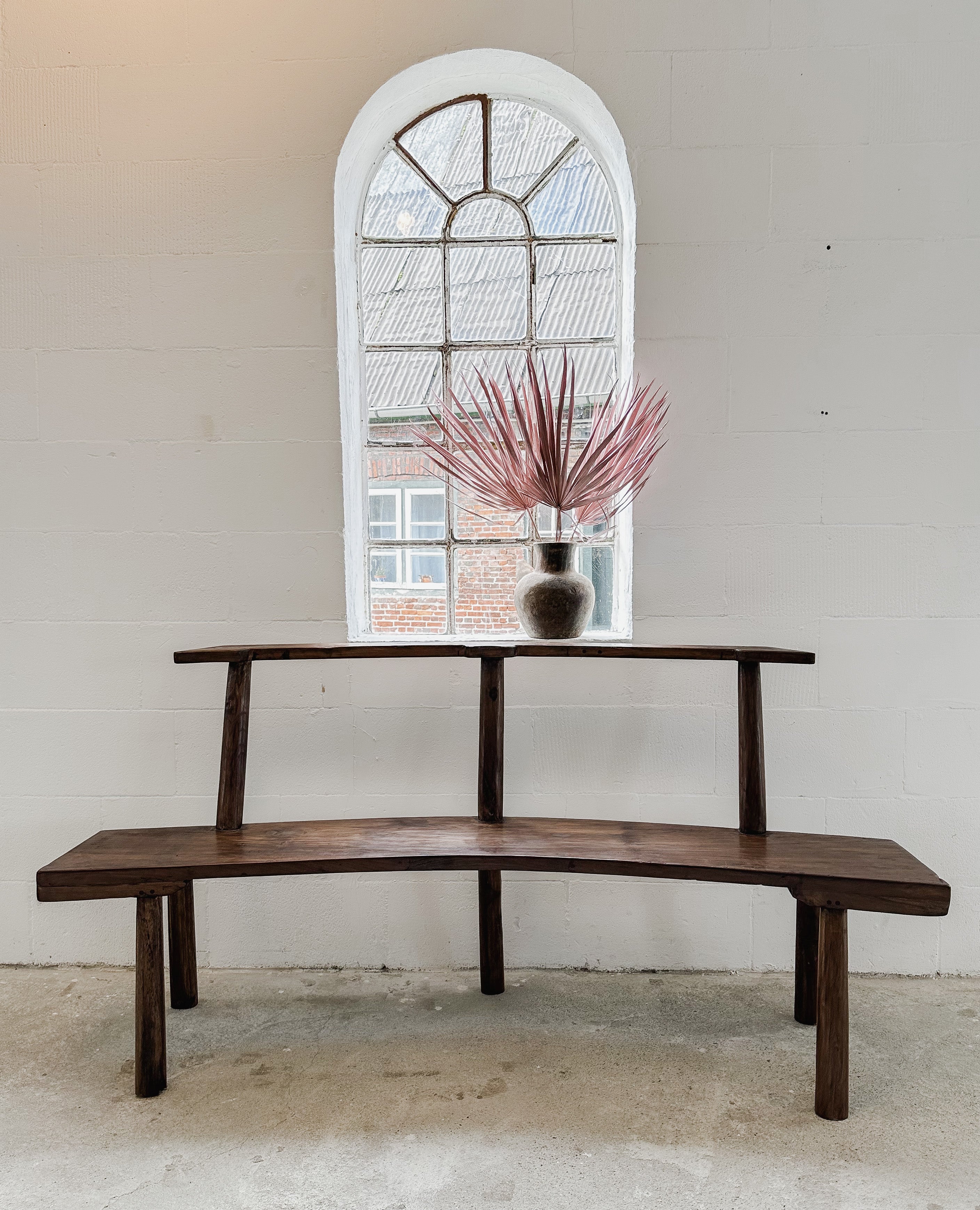 The curved teak bench