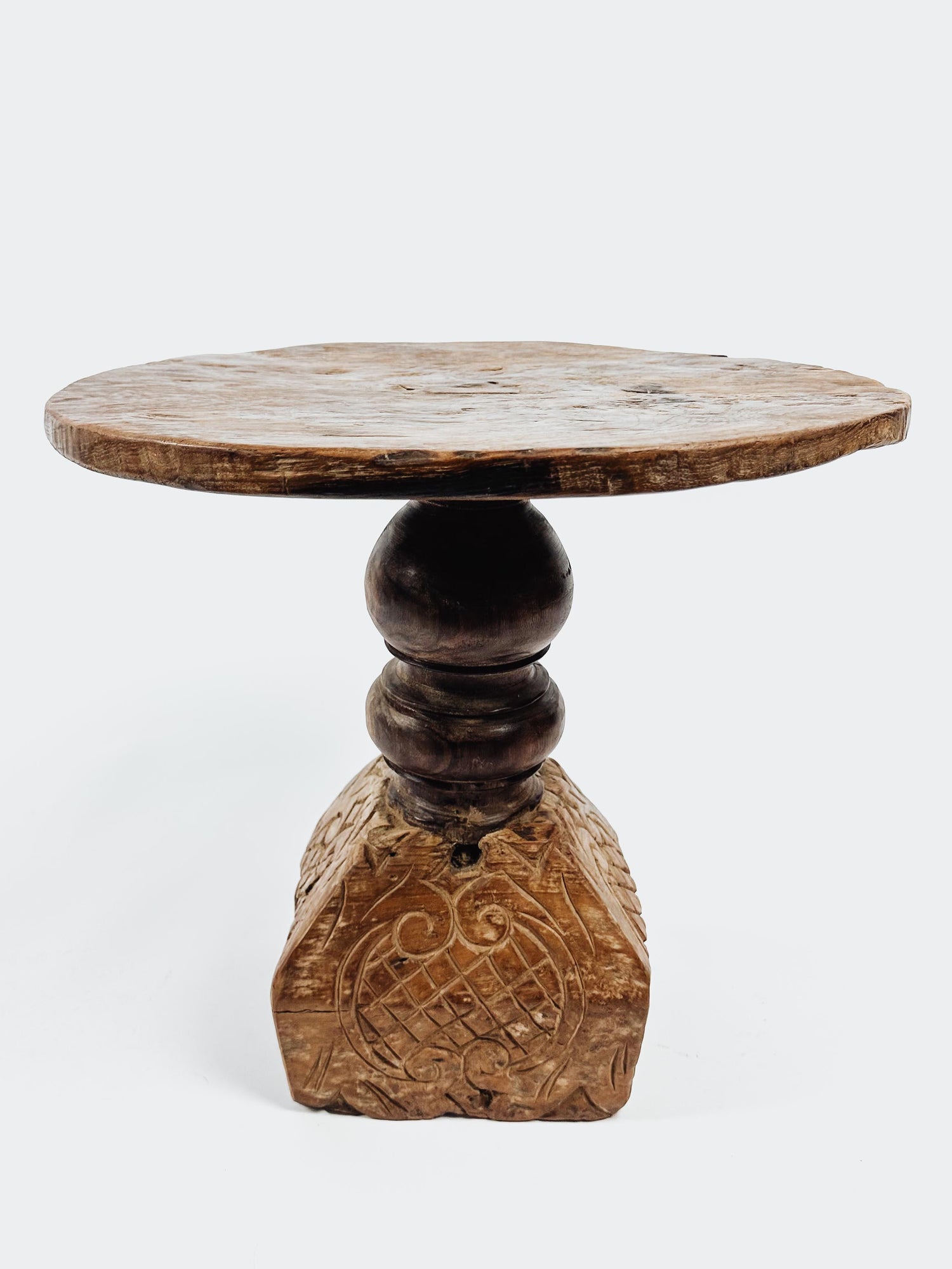 The teak round side table