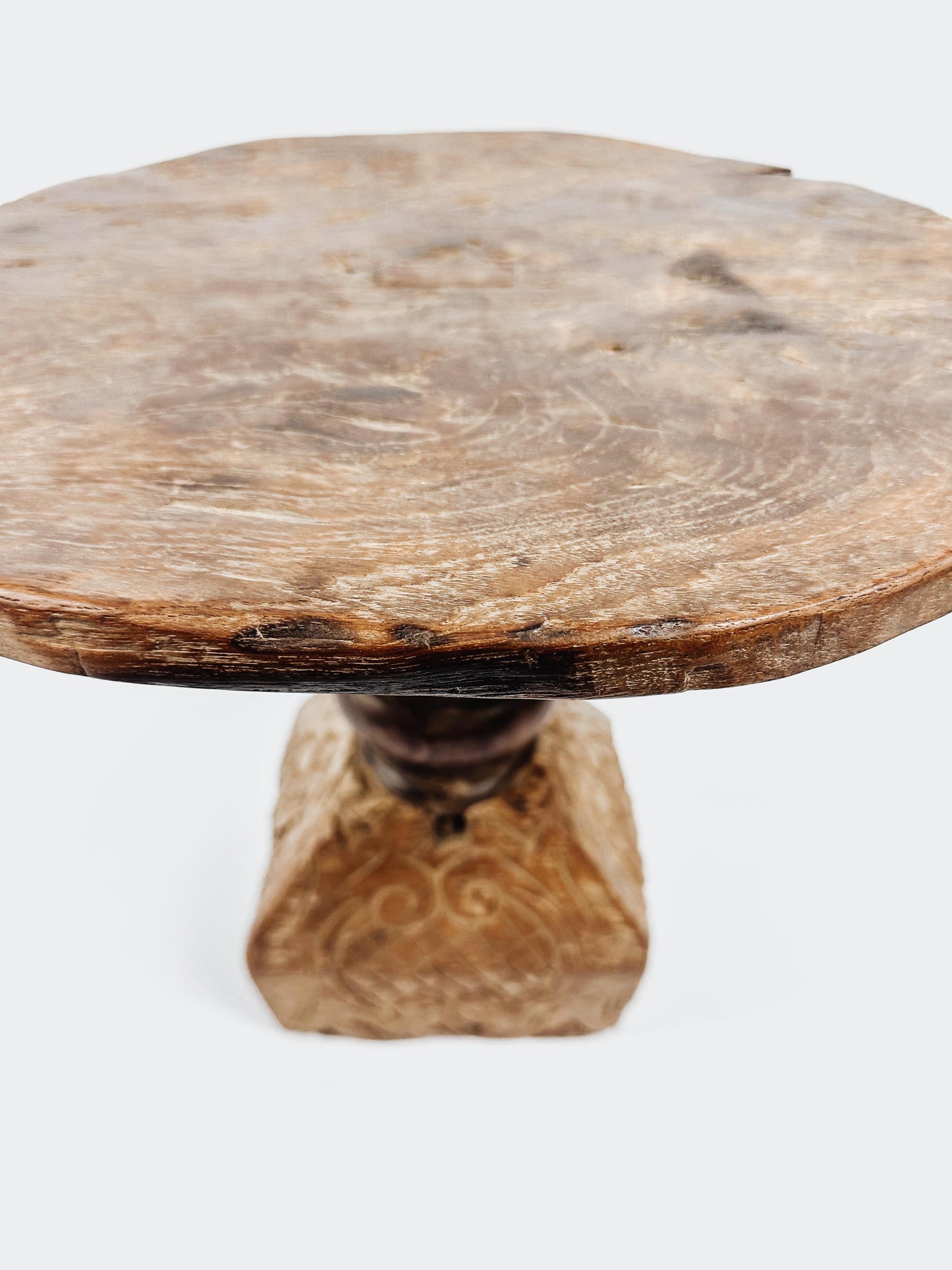 The teak round side table