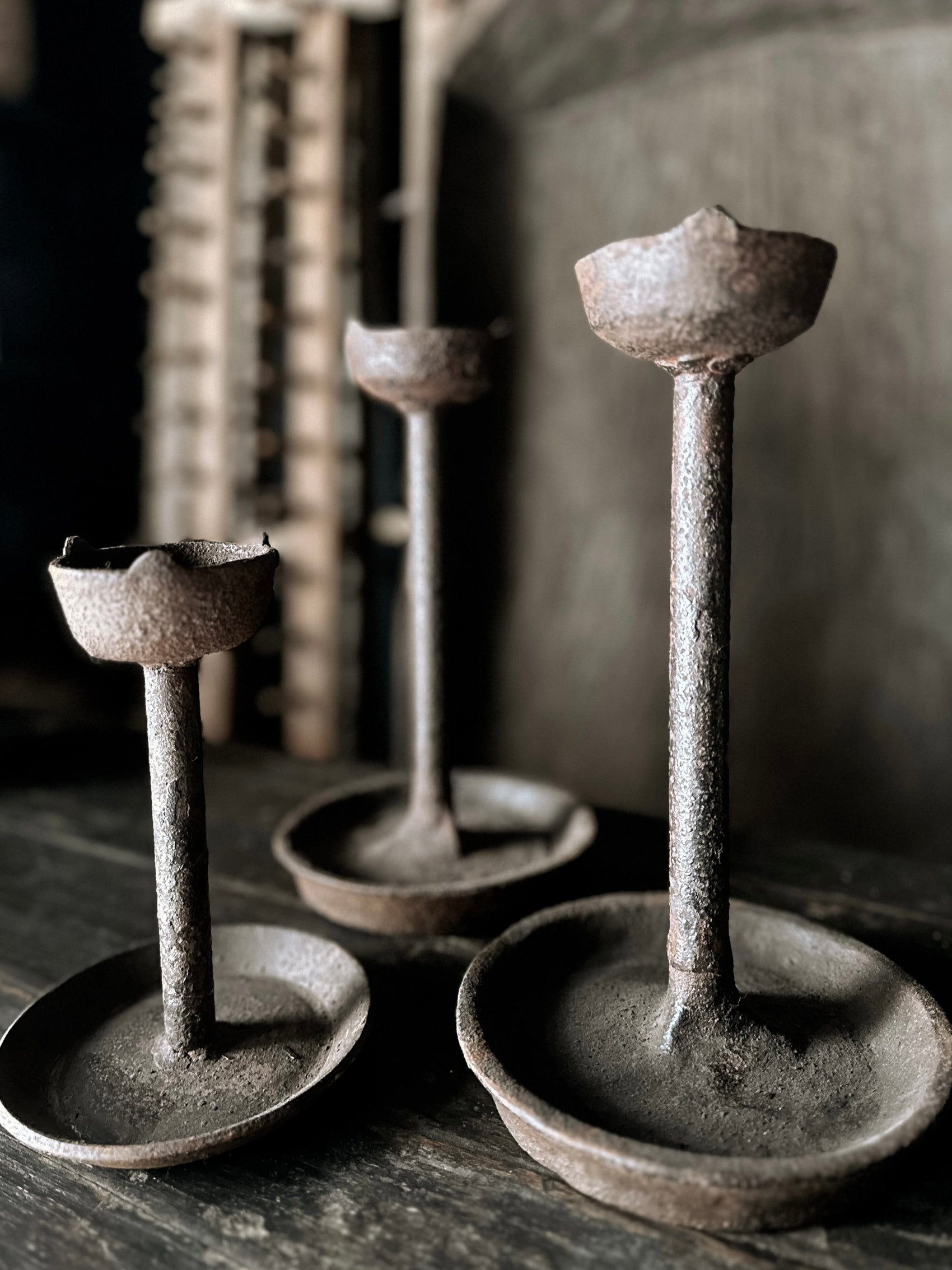 old cast iron candle holder