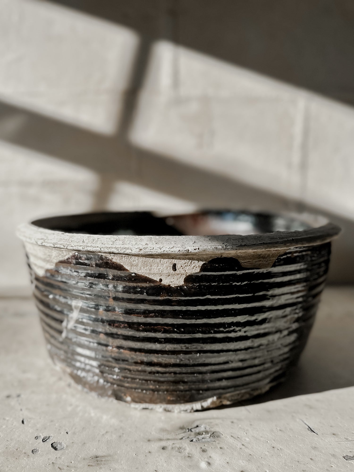 large antique black bowl