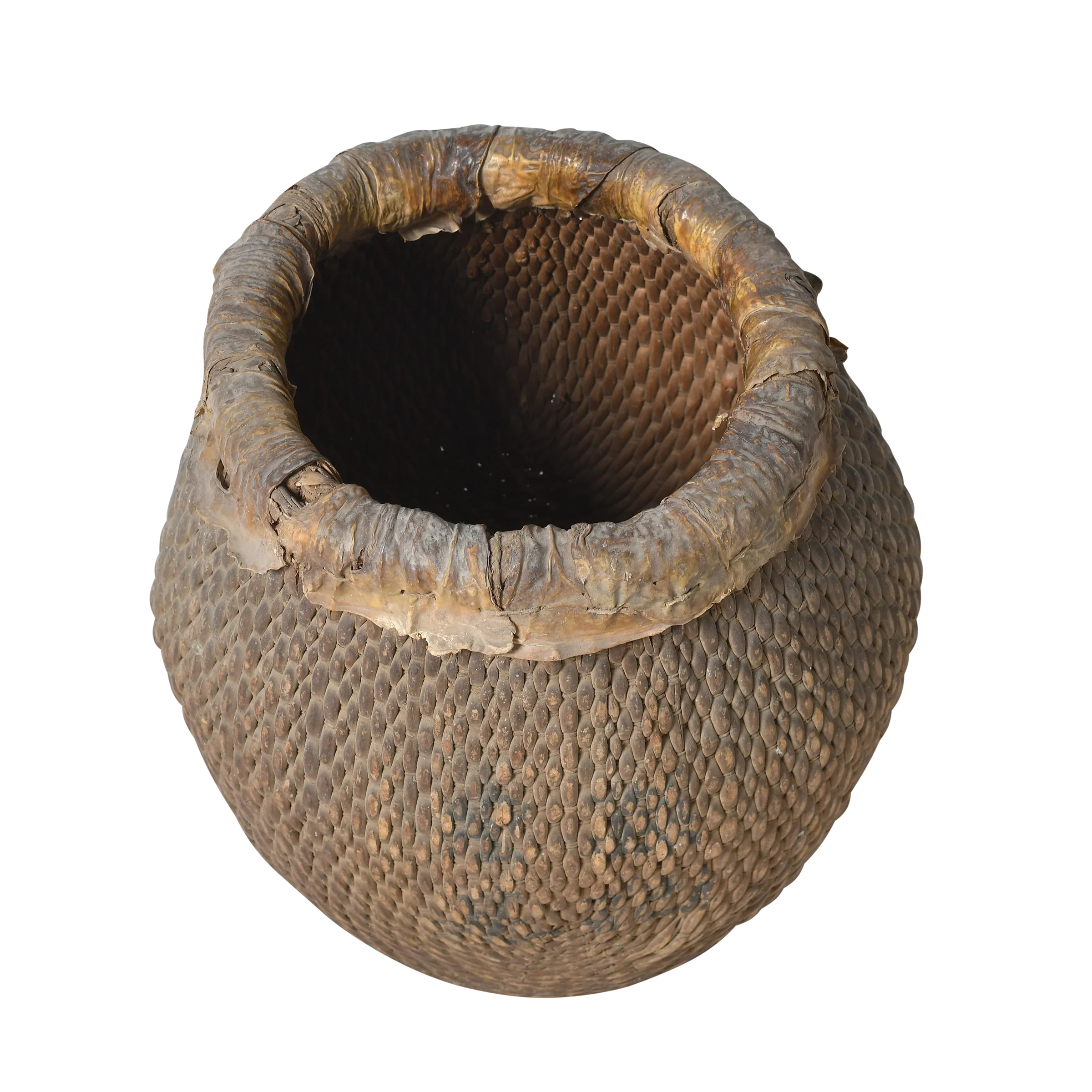 Antique round reed basket with dark patina and rolled rim, visible signs, China.