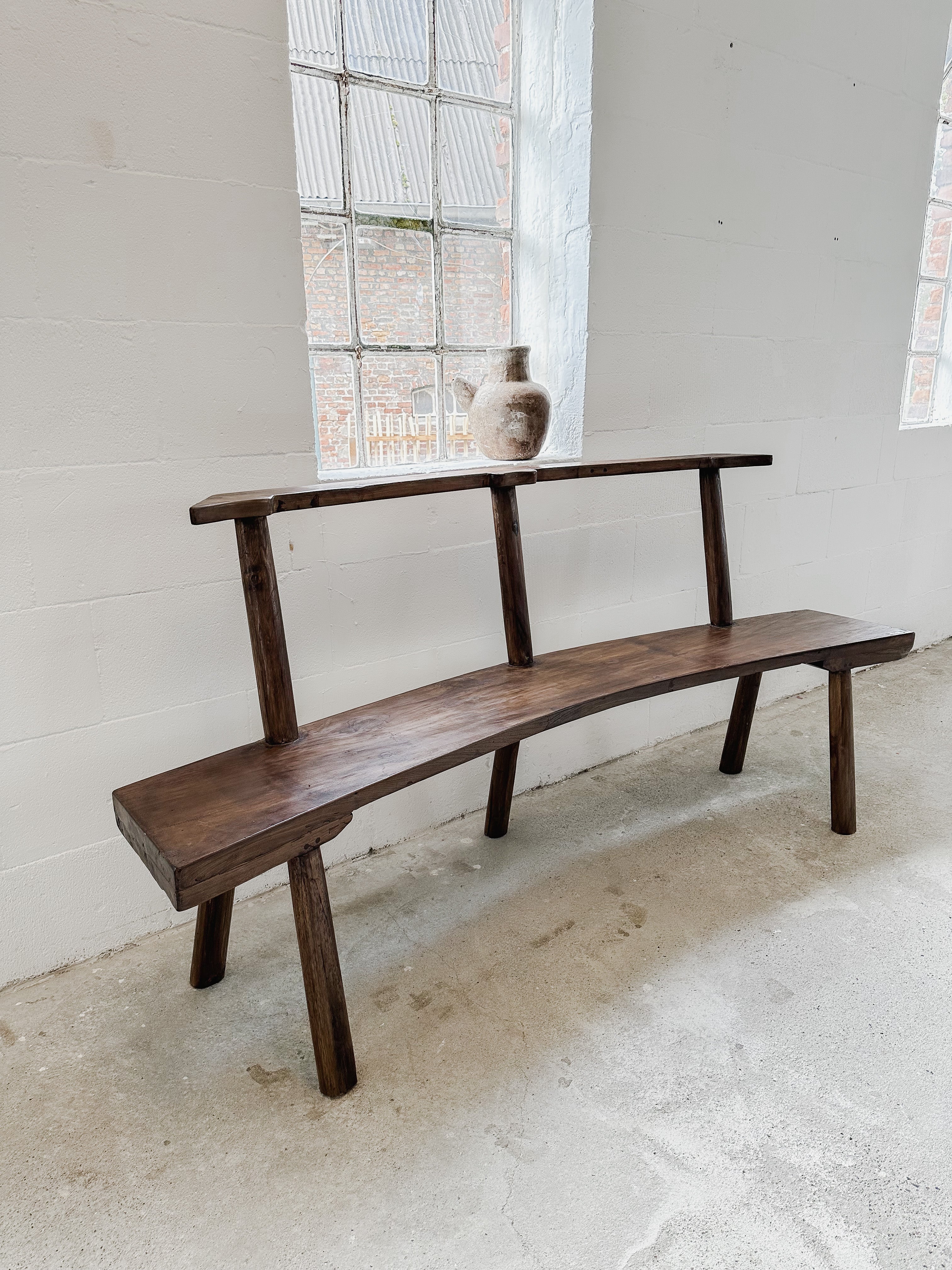 The curved teak bench