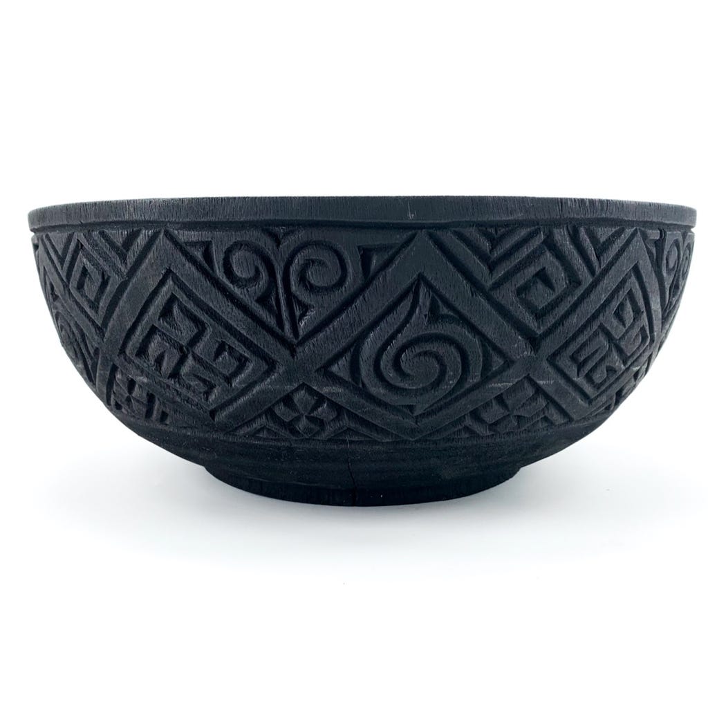 Wooden bowl with carvings