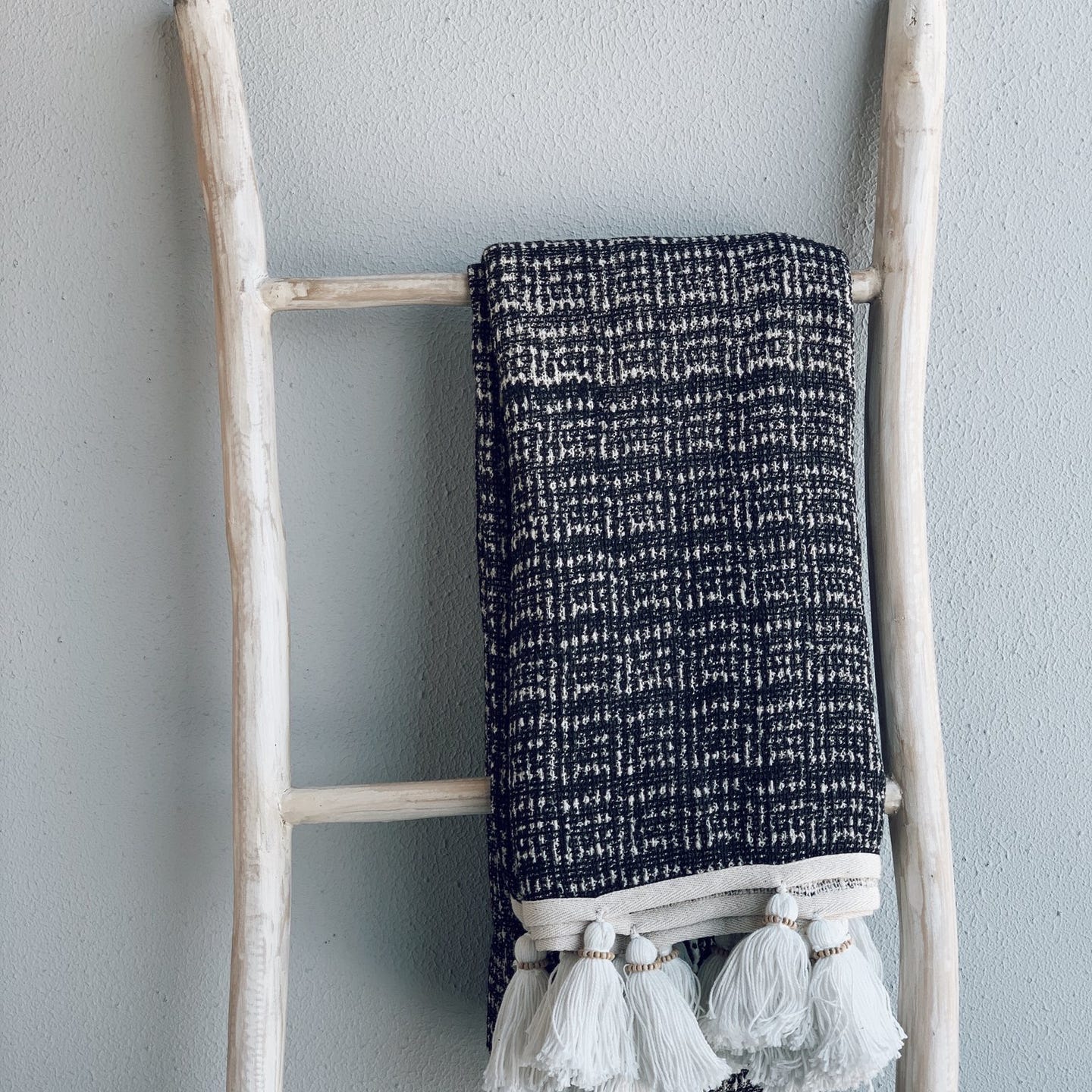 Hand-sewn blanket with tassels