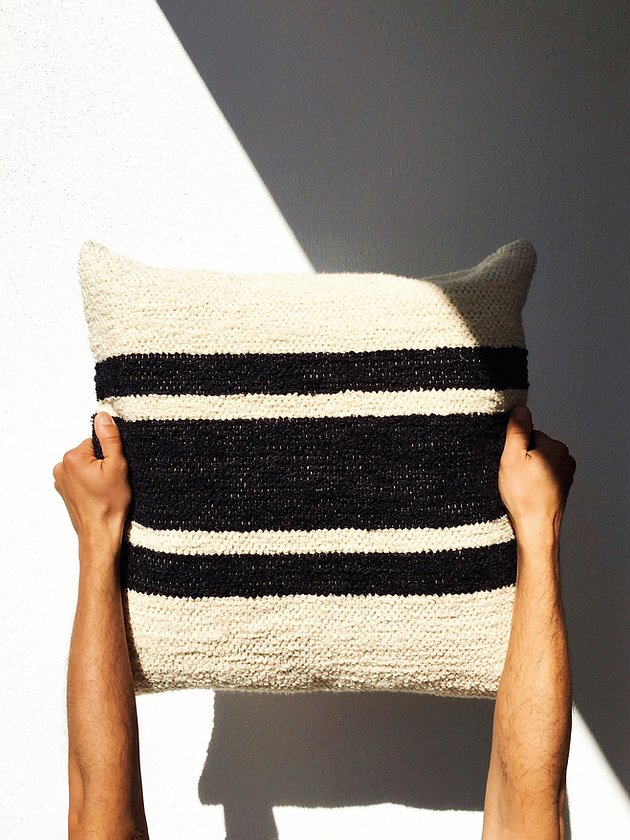 Striped cushion cover made from recycled fashion fabric