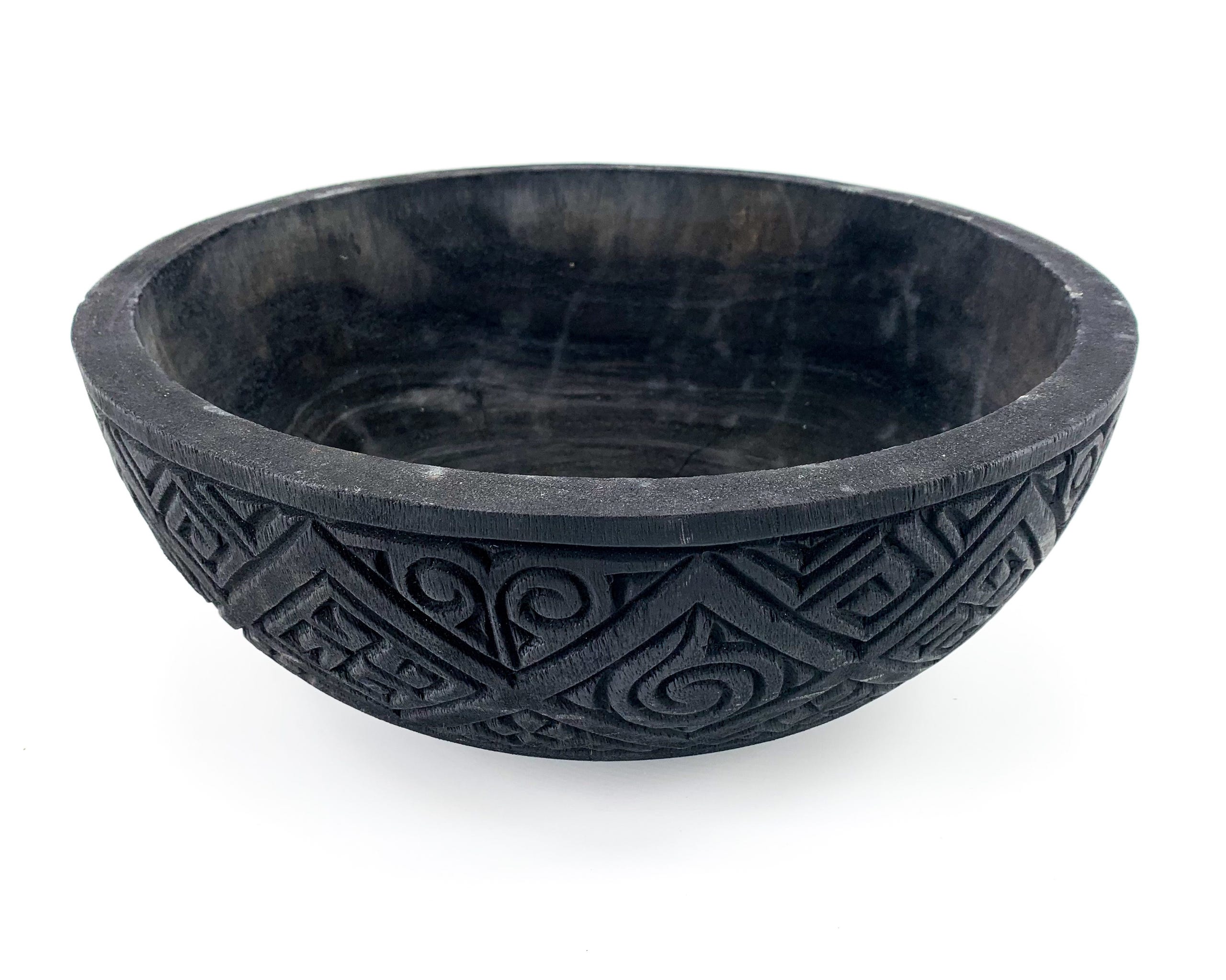 Wooden bowl with carvings
