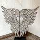 hand carved angel wings on metal stand