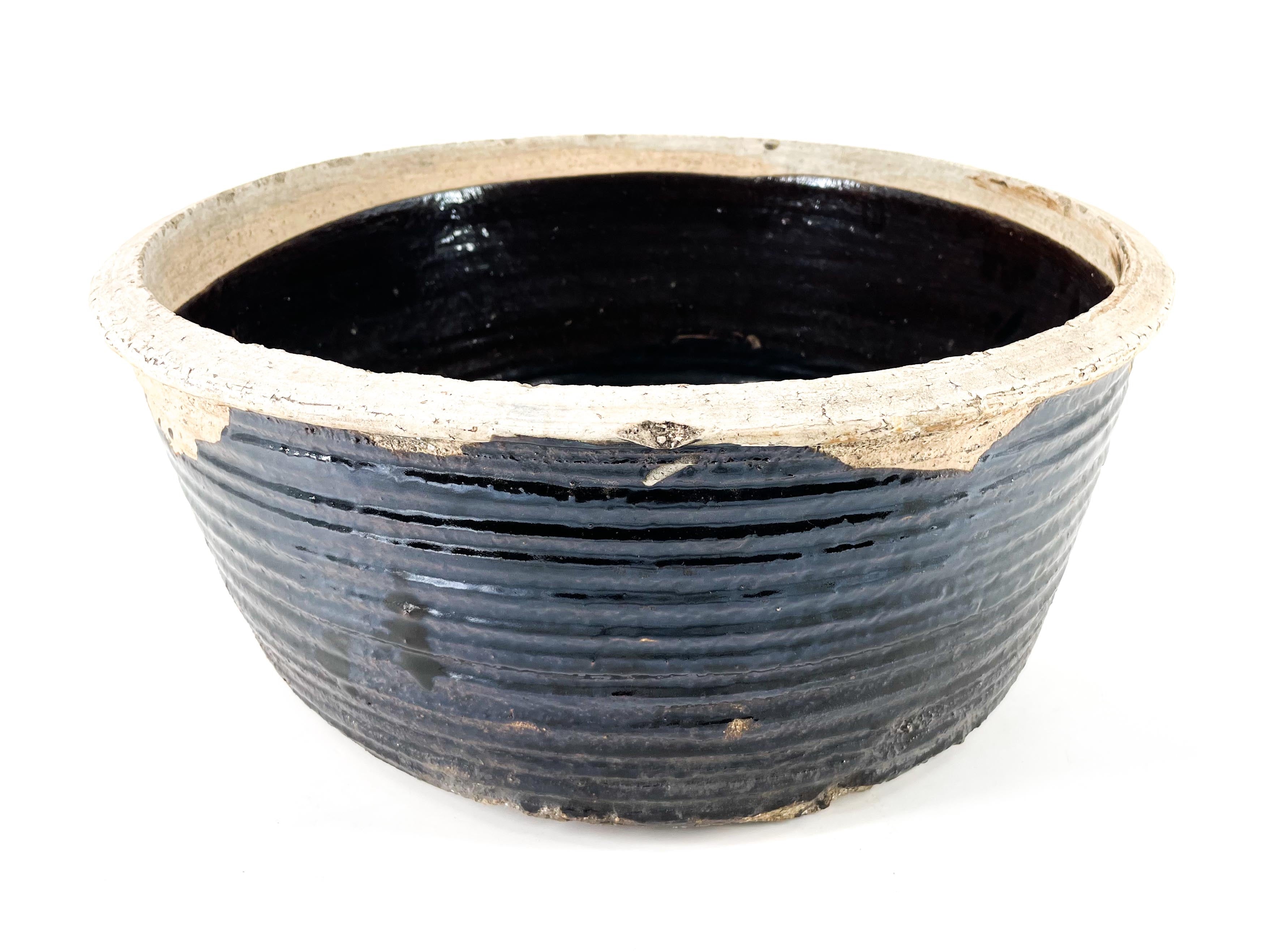 large antique black bowl