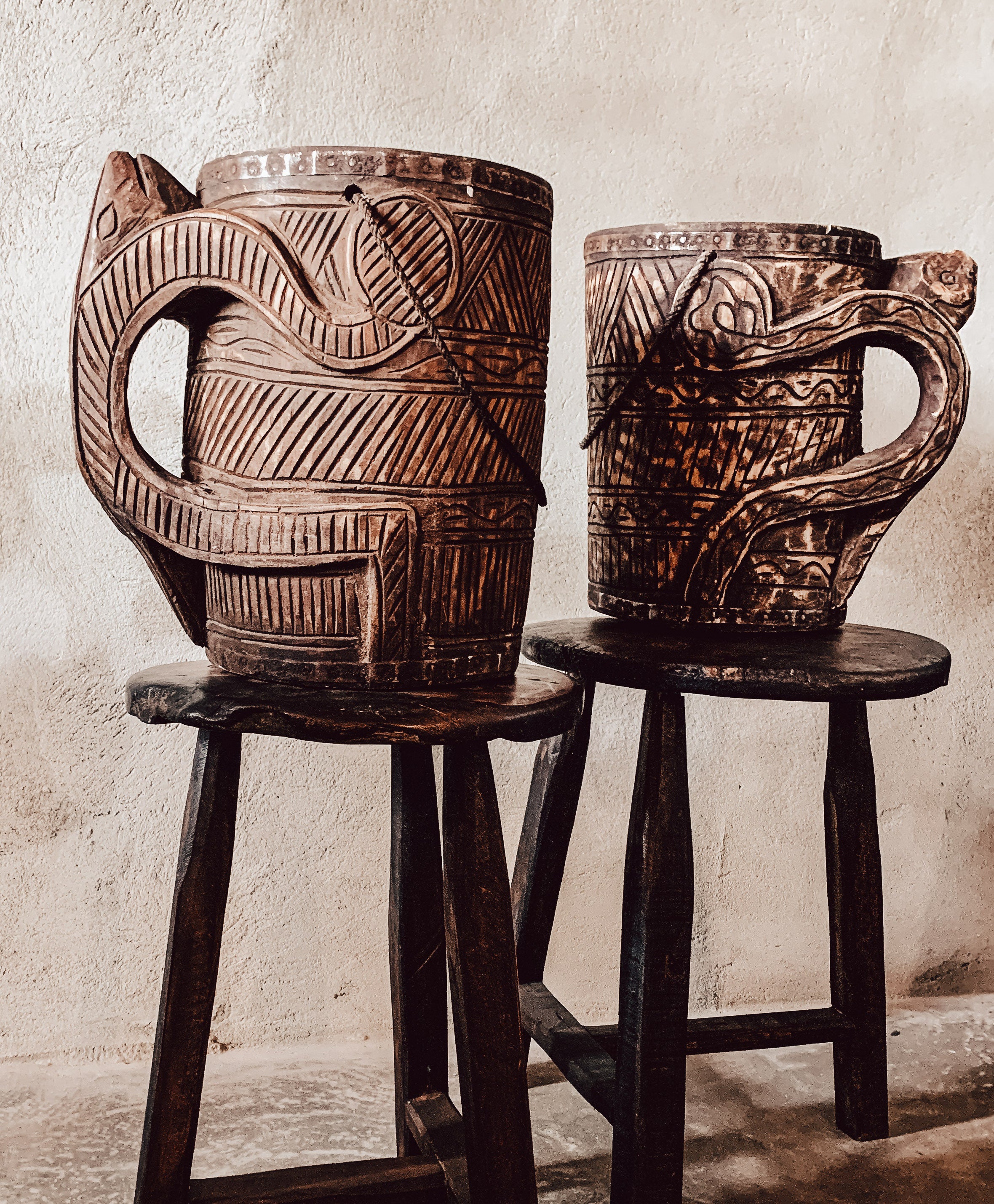 Carved wooden jug with handle
